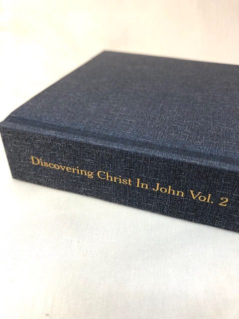 An image of a blue hardback book on a white background
